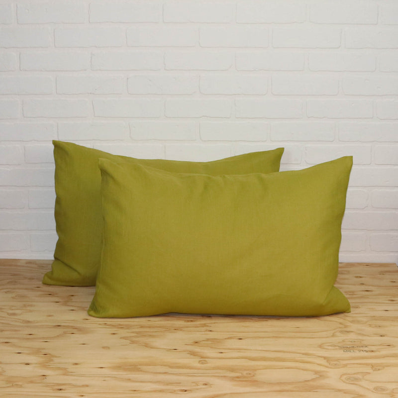 Linen pillowcases in mustard green color. Set of two pillowcases